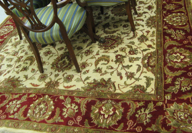 Appraisal: HAND KNOTTED ORIENTAL CARPET Indo-Persian overall floral design in shades