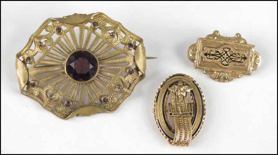 Appraisal: THREE VICTORIAN GOLD FILLED BROOCHES Condition No Specific Condition Recorded