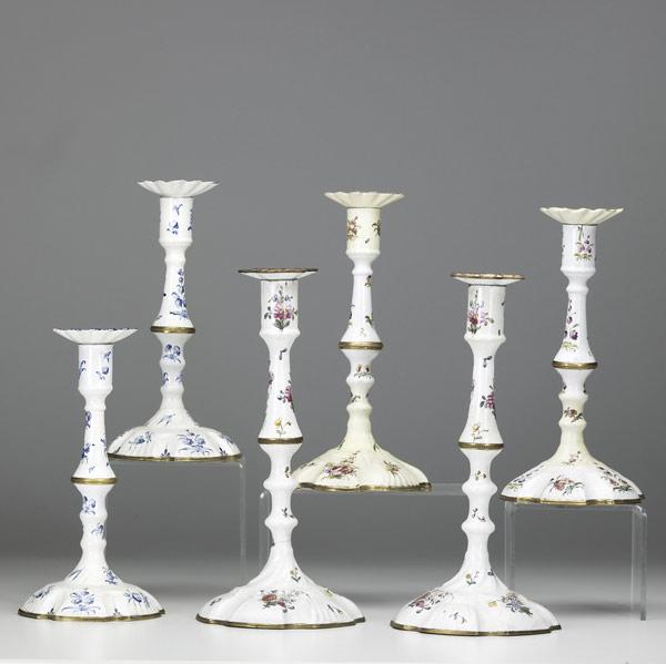 Appraisal: GEORGIAN ENAMEL AND BRASS CANDLESTICKS Three pairs in the Rococo