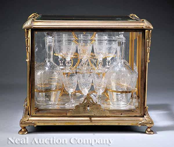 Appraisal: A Continental Polished Bronze and Beveled Glass Cave Liqueurs late