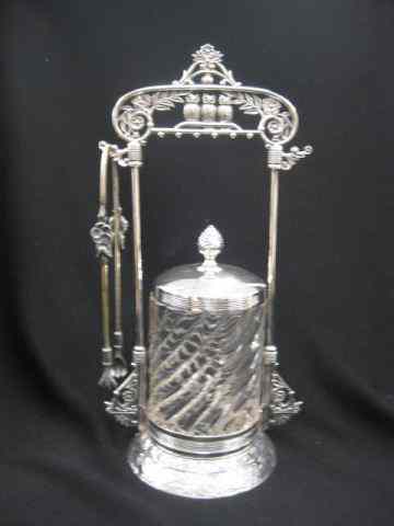 Appraisal: Victorian Pickle Castor swirl design insert with silverplate holder tongs