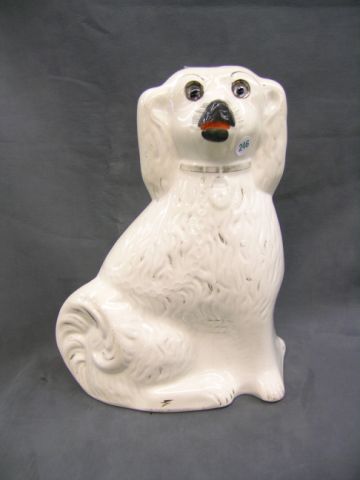 Appraisal: Old Staffordshire Porcelain glass-eyed English Spaniel tall with painted nose