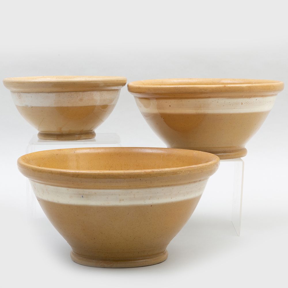 Appraisal: Group of Seven Yellow Ware Pottery Bowls In graduated sizes