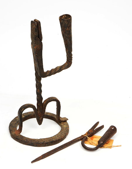 Appraisal: AN TH CENTURY WROUGHT IRON RUSHLIGHT HOLDER with twisted stem