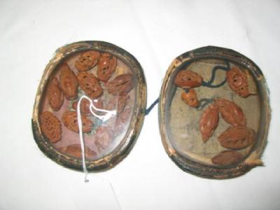 Appraisal: A SET OF CHINESE CARVED SANDALWOOD BEADS modelled mainly as