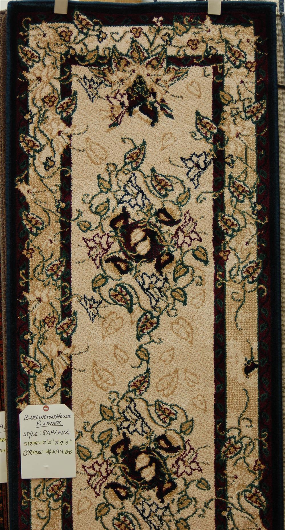 Appraisal: CONTEMPORARY RUNNER having an overall floral pattern ivory field black