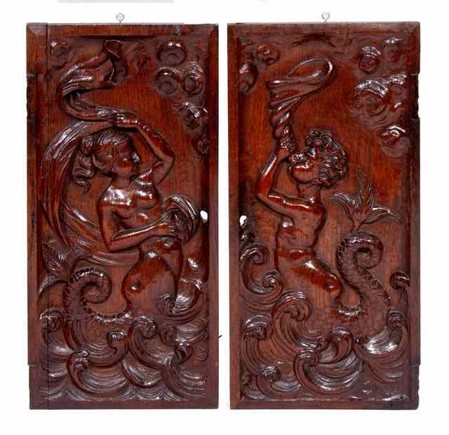 Appraisal: A PAIR OF FRENCH TH CENTURY OAK PANELS carved with