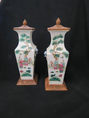 Appraisal: Pair of Chinese Porcelain Vases carved wooden tops stands scenes