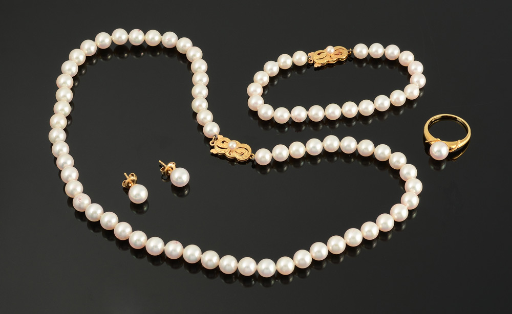 Appraisal: MIKIMOTO PEARL SUITE K yellow gold mountings and clasps The