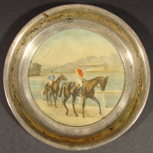 Appraisal: Edwardian circular silver coaster inset with a watercolour of jockeys