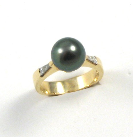 Appraisal: BLACK PEARL AND DIAMOND RING k yellow gold with a