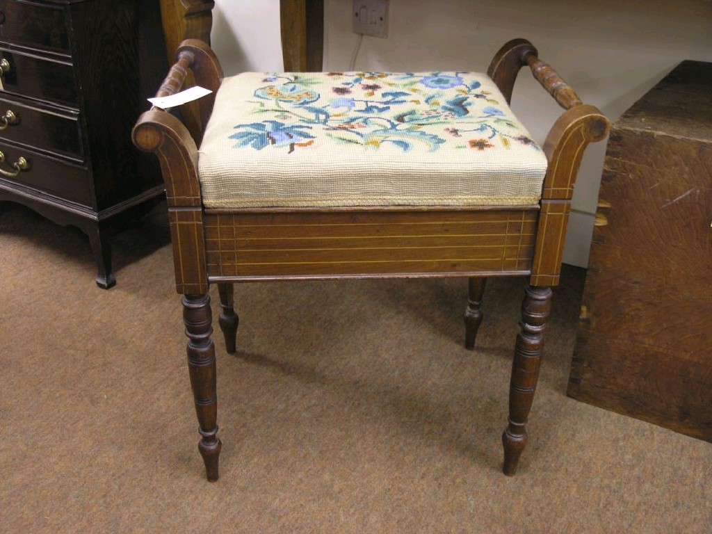 Appraisal: An Edwardian inlaid walnut piano stool with hinged tapestry seat