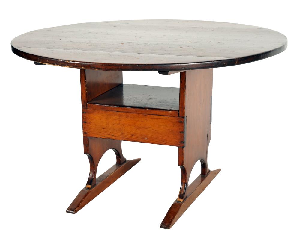 Appraisal: AMERICAN STAINED PINE BENCH TABLEthe round top hinged and lifting