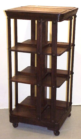 Appraisal: Three-tiered oak bookcase on castors with molded edge top and