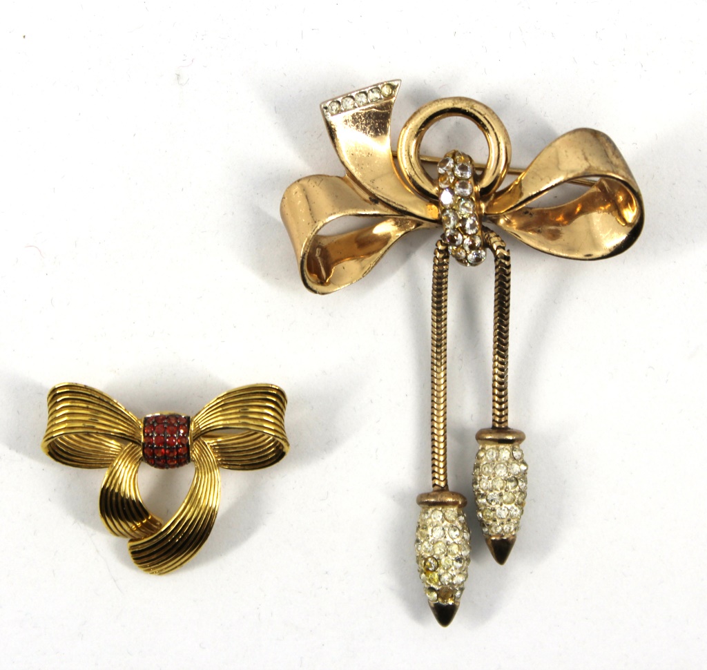 Appraisal: DWECK DIAMONDS CORO-CRAFT GILT STERLING BROOCHES Two gilt sterling bow