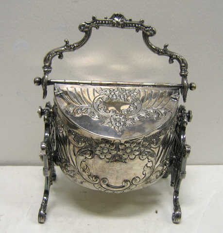 Appraisal: VICTORIAN PLATED SILVER BISCUIT BOX Round body with floral relief