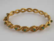 Appraisal: A yellow metal tests carat gold turquoise bangle approx mm