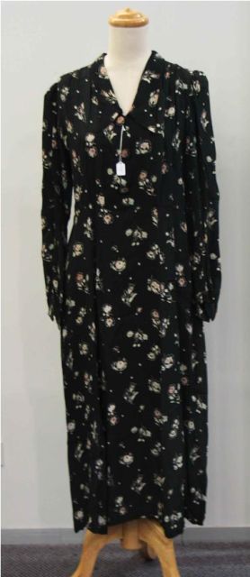 Appraisal: Daydress in black floral printed rayon with smocked shoulders some