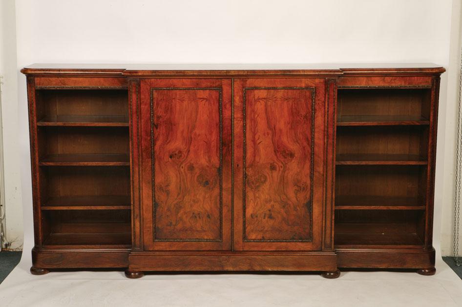 Appraisal: A VICTORIAN BURR WALNUT BREAKFRONT LIBRARY CABINET the well figured