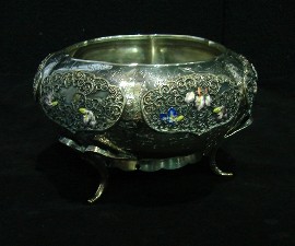 Appraisal: A Japanese silver footed bowl with applied panel decoration of