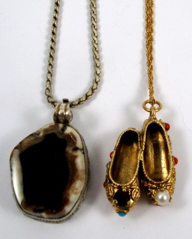 Appraisal: TWO PENDANT NECKLACES one is a k yellow gold pendant