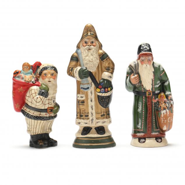 Appraisal: THREE VAILLANCOURT SANTAS CARRYING PACKS dated in dated with glitter