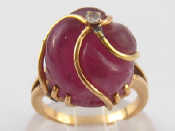 Appraisal: A yellow metal tests carat gold carved ruby and diamond