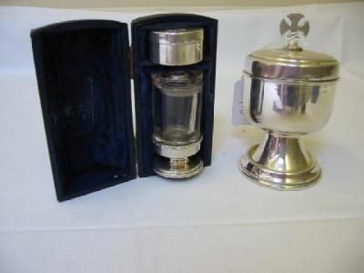 Appraisal: A TRAVELLING COMMUNION SET comprising circular wafer box chased with