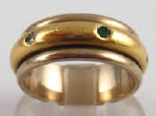 Appraisal: A white metal tests carat gold ring with rotating yellow