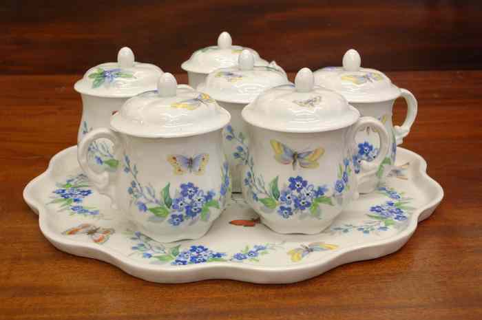 Appraisal: SEVEN PIECE LIMOGES FRANCE PORCELAIN CHOCOLATE SET floral and butterfly