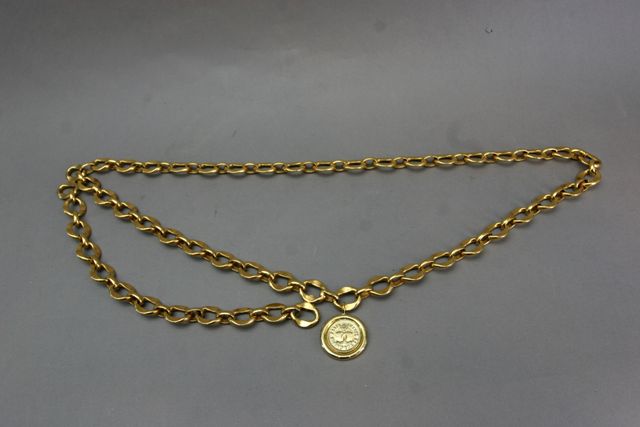 Appraisal: A CoCo Chanel chain link belt with Chanel coin