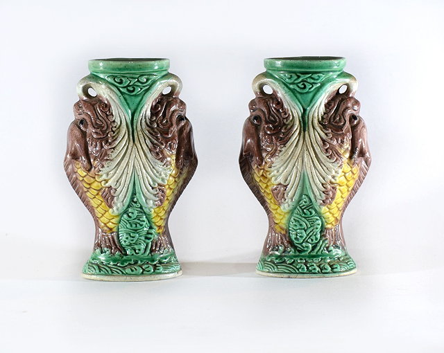 Appraisal: A pair of Chinese polychrome small vases th Centuryeach in