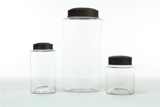 Appraisal: THREE GLASS STORAGE JARS WITH TIN LIDS American nd half-