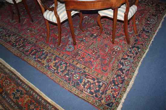 Appraisal: A Heriz carpet with field of geometric foliate motifs on