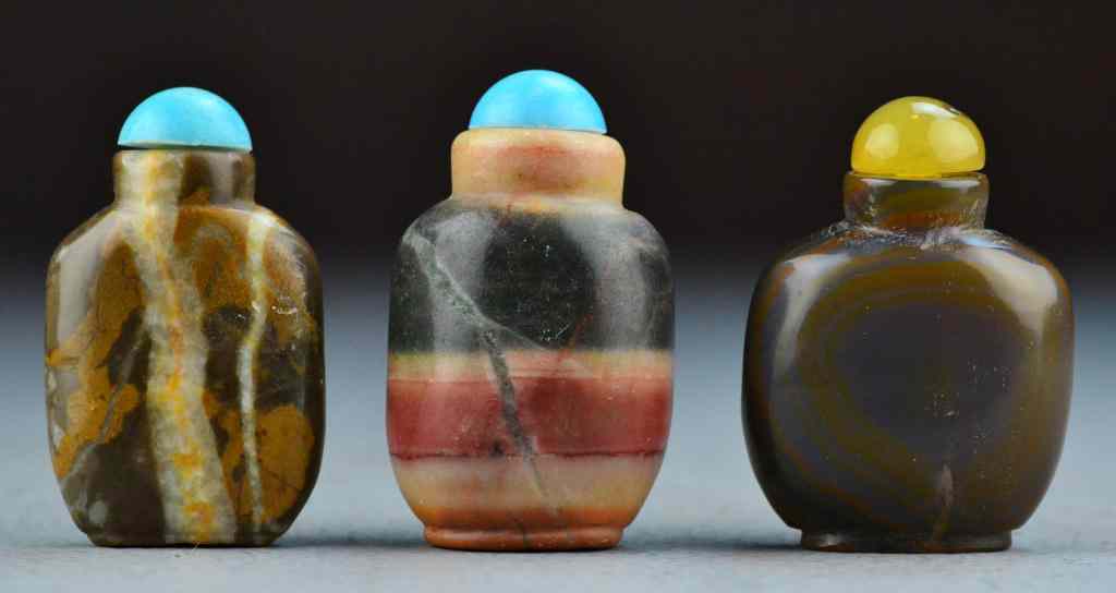 Appraisal: Chinese Agate Snuff BottlesTo include three agate examples two with