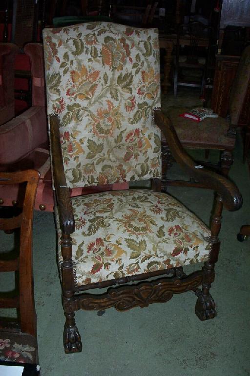 Appraisal: A continental walnut armchair with upholstered seat and back shaped