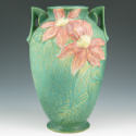 Appraisal: Roseville Clematis handled vase in green with deep red blossoms