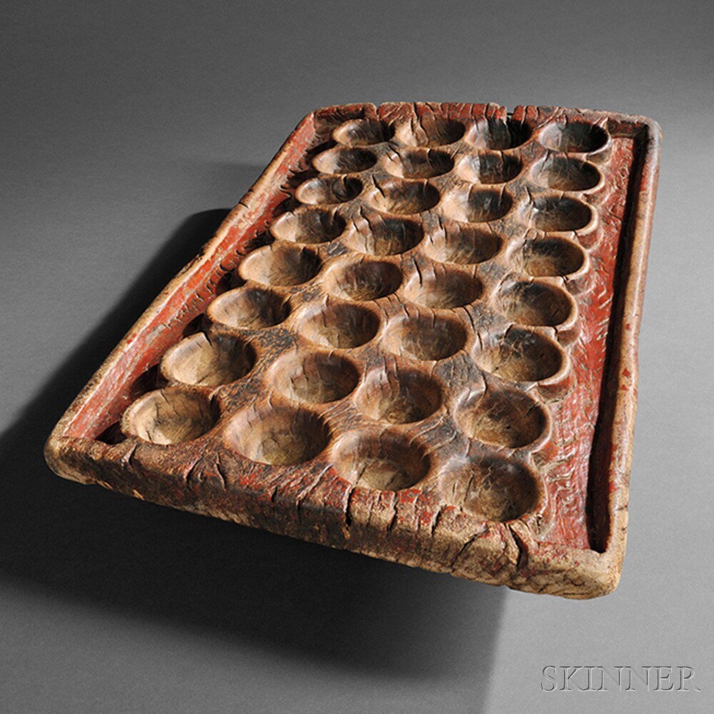 Appraisal: Mankala Carved Wood Game Board with remains of red pigment