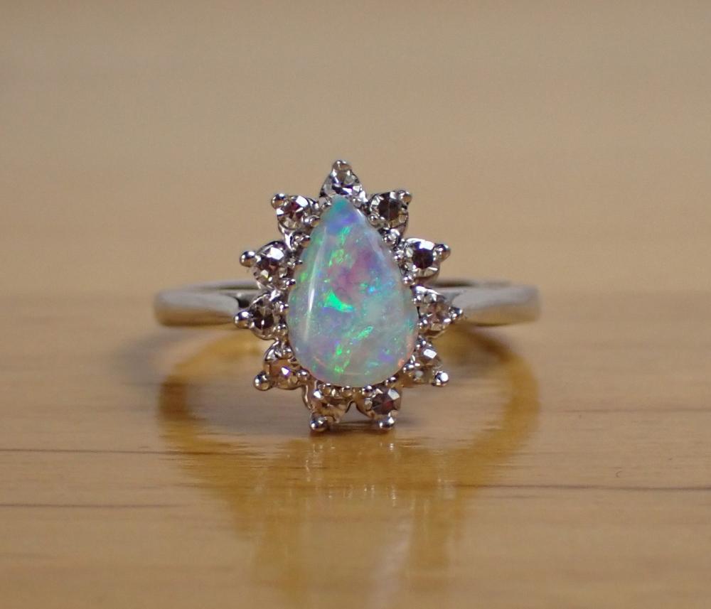 Appraisal: OPAL DIAMOND AND FOURTEEN KARAT GOLD RING The k white