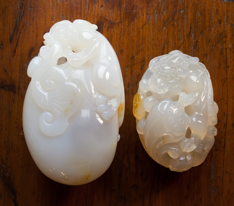 Appraisal: TWO CHINESE CARVED AGATE HAND PIECES with carved foo dog