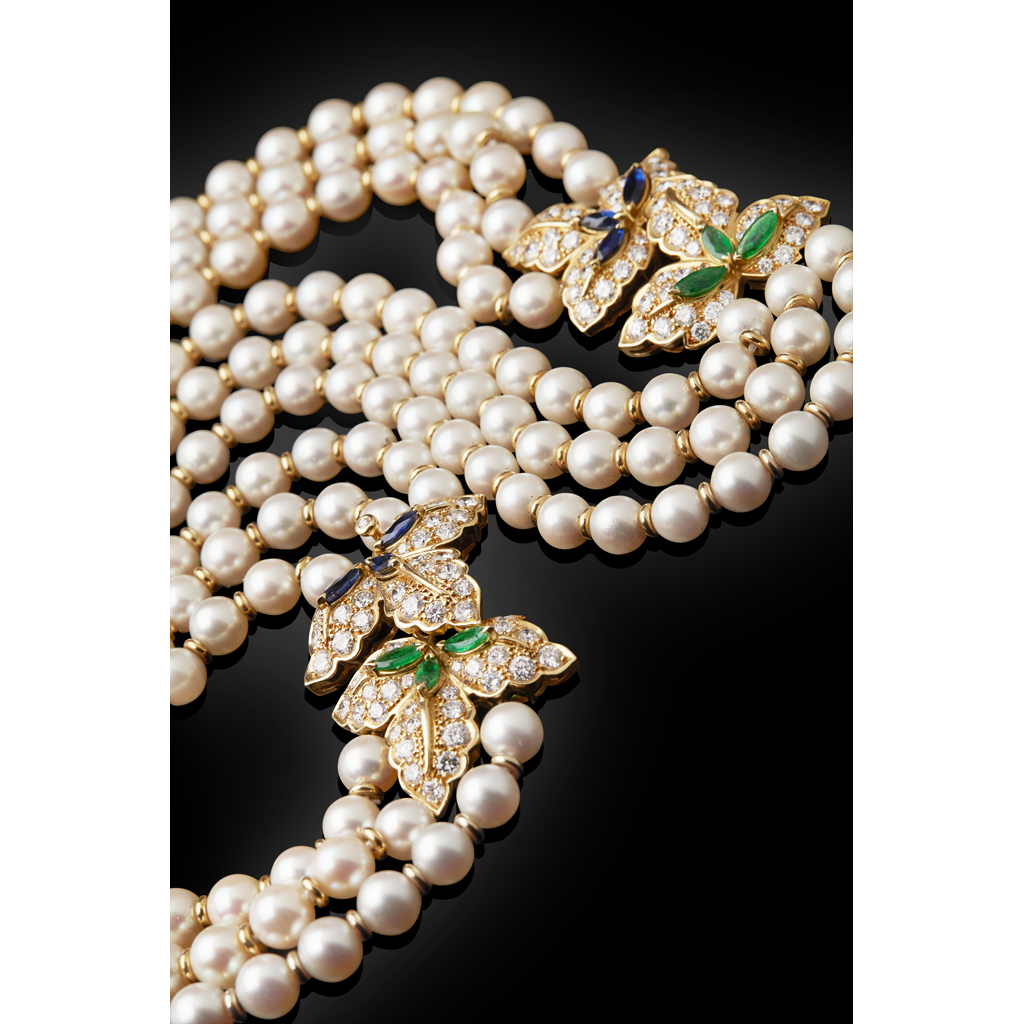 Appraisal: A cultured pearl diamond sapphire and emerald necklacecomposed of three