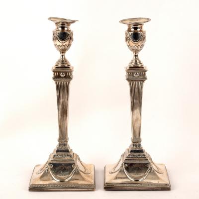 Appraisal: A pair of George III silver candlesticks maker indistinct London