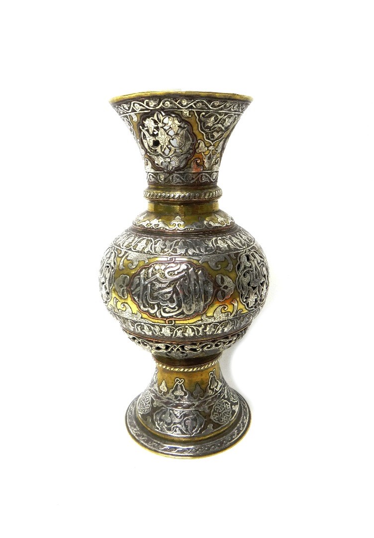 Appraisal: An Islamic silvered and brass pierced lamp late th early