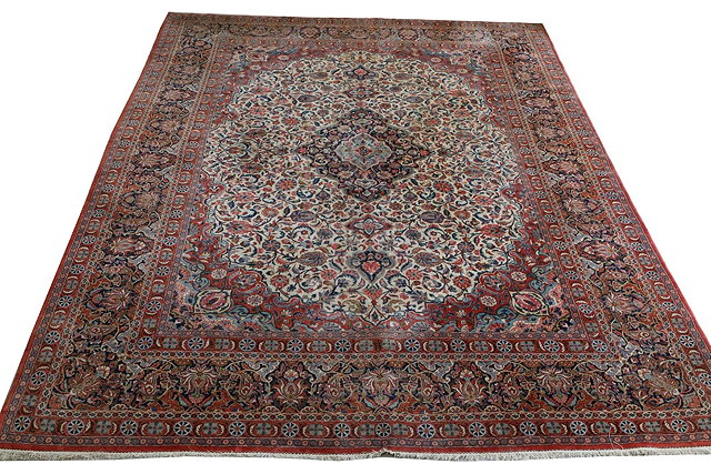 Appraisal: A PERSIAN KASHAN FORMAL CARPET with central blue ground medallion