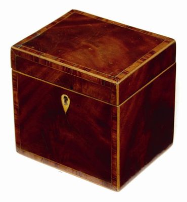 Appraisal: A George III mahogany cube tea caddy with tulipwood cross