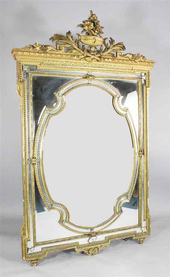 Appraisal: An elaborate th century carved giltwood and gesso mirror with