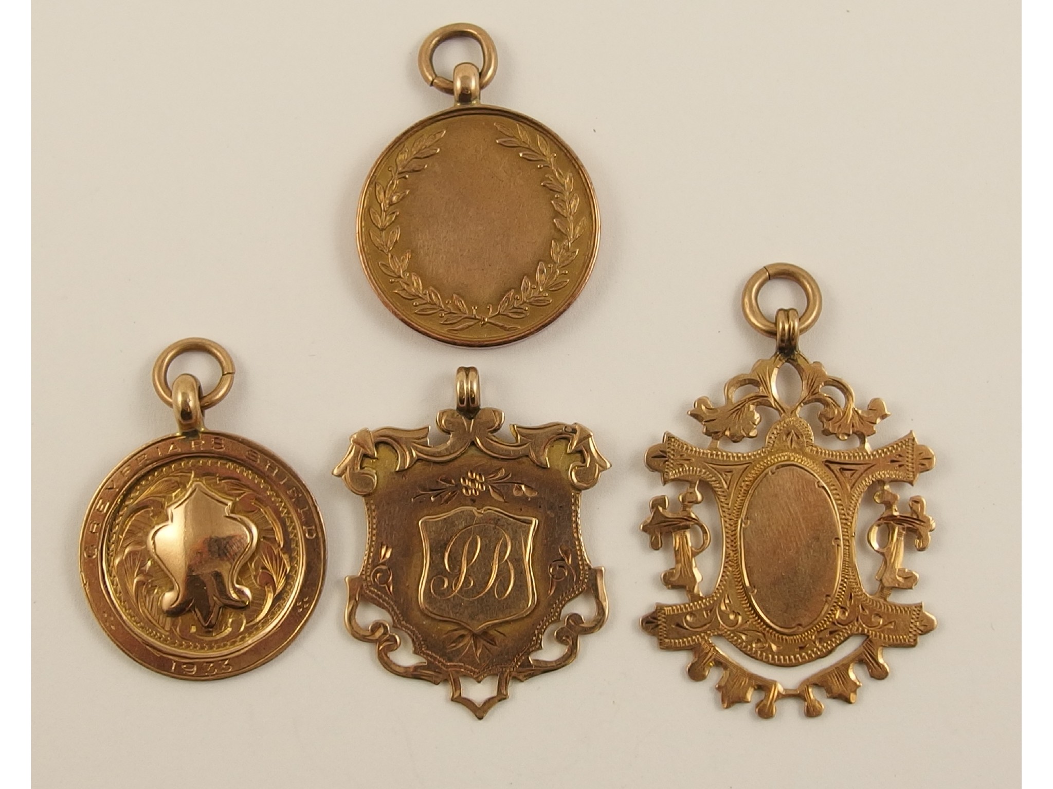 Appraisal: Four ct medallions approx weight gms combined