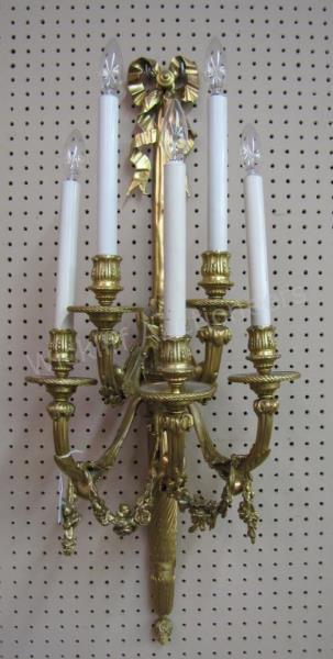 Appraisal: A pair of French style cast bronze wall sconces with