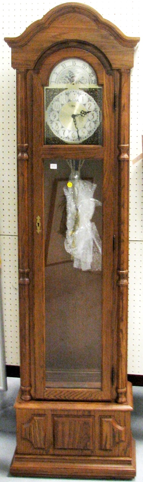 Appraisal: Ridgeway tall clock oak and glass case brass pendulum and