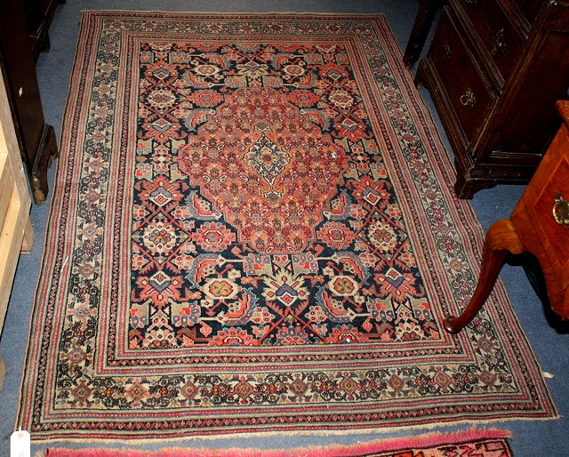 Appraisal: AN OLD HAMADAN BLUE GROUND RUG with a central brown